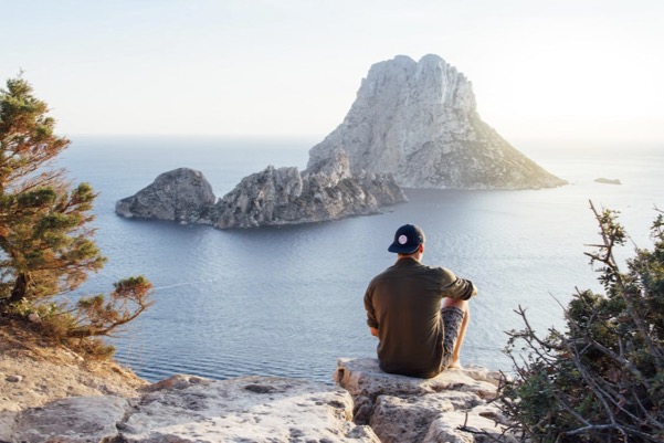 https://www.pexels.com/photo/rear-view-of-man-sitting-on-rock-by-sea-307008/